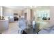 Open concept kitchen and dining area with gray cabinets, a table, and an open living space at 3806 Jack Vernon Cir, Powder Springs, GA 30127