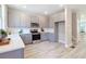 Bright kitchen featuring gray cabinets, stainless steel appliances, and white countertops at 3806 Jack Vernon Cir, Powder Springs, GA 30127