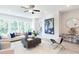 Sunlit living room with stylish furnishings, contemporary decor, and large windows offering scenic views at 3806 Jack Vernon Cir, Powder Springs, GA 30127