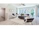 Bright living room with modern decor, stylish seating, and large windows offering scenic views at 3806 Jack Vernon Cir, Powder Springs, GA 30127