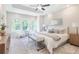 Spacious main bedroom with large windows, tray ceiling, and neutral decor at 3806 Jack Vernon Cir, Powder Springs, GA 30127