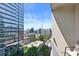 Condo balcony offers expansive city views, featuring modern architecture and a clear, blue sky at 923 Peachtree Ne St # 1625, Atlanta, GA 30309