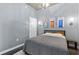 Bedroom with a platform bed, concrete ceiling, door and accent lighting at 923 Peachtree Ne St # 1625, Atlanta, GA 30309
