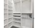 Walk-in closet featuring multiple shelves, drawers, and clothing rods at 923 Peachtree Ne St # 1625, Atlanta, GA 30309