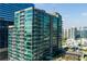 Modern high-rise condominium building with walls of glass and balconies at 923 Peachtree Ne St # 1625, Atlanta, GA 30309