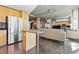 Open concept living space featuring a stainless steel refrigerator, adjacent to the kitchen and living area at 923 Peachtree Ne St # 1625, Atlanta, GA 30309