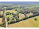 This aerial view captures expansive land with mature trees and open spaces, ideal for building at 1025 Rocky Plains Rd, Covington, GA 30016