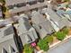 A high aerial view of a group of suburban homes with shingled roofs at 10686 Austen Bnd, Alpharetta, GA 30022