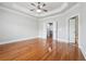 Spacious bedroom with hardwood floors, tray ceiling, and ceiling fan at 10686 Austen Bnd, Alpharetta, GA 30022