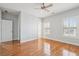 Bedroom with wood floors, ceiling fan and shutters at 10686 Austen Bnd, Alpharetta, GA 30022
