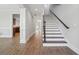 Inviting entryway featuring wood-look floors, white trim and natural light at 10686 Austen Bnd, Alpharetta, GA 30022