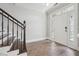 Elegant entryway with hardwood floors and a staircase leading to the upper level at 10686 Austen Bnd, Alpharetta, GA 30022