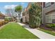 Lovely townhouses, green lawns and a concrete sidewalk at 10686 Austen Bnd, Alpharetta, GA 30022