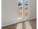 A pair of glass doors provides views into the backyard at 8234 Coldstream Dr, Fairburn, GA 30213