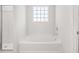 Bathroom with a large tub and shower at 8234 Coldstream Dr, Fairburn, GA 30213