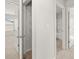 Hallway featuring linen closet, bath and bedrooms at 8234 Coldstream Dr, Fairburn, GA 30213