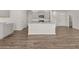 Gourmet kitchen with granite countertops, stainless steel appliances, and hardwood floors at 8234 Coldstream Dr, Fairburn, GA 30213