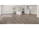 Spacious open-concept living area featuring hardwood floors and modern finishes at 8234 Coldstream Dr, Fairburn, GA 30213