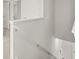Bright stairway with white banister, leading to the upper level at 8234 Coldstream Dr, Fairburn, GA 30213