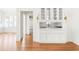 Elegant bar area featuring custom cabinetry, a wine fridge, and stone countertops at 1585 S Ponce De Leon Ne Ave # 20, Atlanta, GA 30307