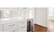 Elegant bar area featuring custom cabinetry, a wine fridge, and stone countertops at 1585 S Ponce De Leon Ne Ave # 20, Atlanta, GA 30307