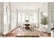 Bright dining room with hardwood floors, a modern chandelier, and plenty of natural light at 1585 S Ponce De Leon Ne Ave # 20, Atlanta, GA 30307