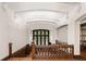 Bright hallway with gorgeous white trim, hardwood floors, and a stained glass window at 1585 S Ponce De Leon Ne Ave # 20, Atlanta, GA 30307