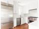 Modern kitchen with stainless steel appliances, white cabinets, and marble countertops at 1585 S Ponce De Leon Ne Ave # 20, Atlanta, GA 30307