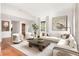 Bright living room featuring hardwood floors, a large sectional couch, and neutral decor at 1585 S Ponce De Leon Ne Ave # 20, Atlanta, GA 30307