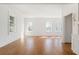 Bright, open living room with hardwood floors, white walls, large windows, and classic trim at 1585 S Ponce De Leon Ne Ave # 20, Atlanta, GA 30307