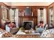 Cozy living room featuring a wood-burning fireplace and classic wood paneling at 1585 S Ponce De Leon Ne Ave # 20, Atlanta, GA 30307