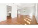 Open living room with hardwood floors, bright windows, and kitchen featuring white cabinets at 1585 S Ponce De Leon Ne Ave # 20, Atlanta, GA 30307