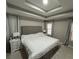 Spacious main bedroom with tray ceilings, two windows and an upholstered headboard at 2657 Mcguire Nw Dr, Kennesaw, GA 30144