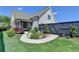 Beautifully landscaped backyard with a black fence, lush grass, and stone pathway at 3460 Montebello Pkwy, Cumming, GA 30028