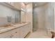 Bathroom featuring double vanities, granite countertops, and a frameless glass shower at 3460 Montebello Pkwy, Cumming, GA 30028