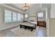 Primary bedroom with tray ceilings, plantation shutters, and stylish decor at 3460 Montebello Pkwy, Cumming, GA 30028