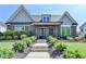 Beautiful brick home with a well-manicured lawn and inviting front entrance at 3460 Montebello Pkwy, Cumming, GA 30028