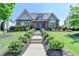 Charming home with landscaped front yard, brick facade, and inviting walkway at 3460 Montebello Pkwy, Cumming, GA 30028