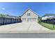 Three-car garage with a spacious driveway and well-maintained exterior at 3460 Montebello Pkwy, Cumming, GA 30028
