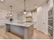 Spacious kitchen with granite countertops, stainless steel appliances, and light gray cabinetry at 3460 Montebello Pkwy, Cumming, GA 30028