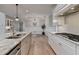 A gourmet kitchen showcases granite countertops, stainless appliances, and modern white cabinetry at 3460 Montebello Pkwy, Cumming, GA 30028