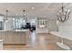 Open concept living room with modern lighting, hardwood floors, and stylish furnishings at 3460 Montebello Pkwy, Cumming, GA 30028