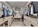 Spacious walk-in closet with custom shelving, drawers, and ample storage for clothes and shoes at 3460 Montebello Pkwy, Cumming, GA 30028