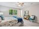 Comfortable bedroom with neutral decor, ample natural light, and plush carpet at 6693 Doublegate Ln, Rex, GA 30273