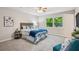 Cozy bedroom with plush carpet, ceiling fan, and lots of natural light at 6693 Doublegate Ln, Rex, GA 30273
