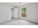 Neutral bedroom with plush carpet, a closet, and neutral walls at 6693 Doublegate Ln, Rex, GA 30273