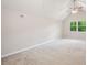 Bright bonus room with vaulted ceilings, a ceiling fan, and carpet at 6693 Doublegate Ln, Rex, GA 30273