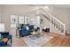 Spacious living room with new floors, a staircase to the second floor, and an open concept design at 6693 Doublegate Ln, Rex, GA 30273