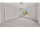 Well-lit bedroom with a large window and closet at 990 Lilac Arbor Rd, Dacula, GA 30019