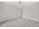 Clean bedroom featuring neutral carpet and a simple light fixture at 990 Lilac Arbor Rd, Dacula, GA 30019